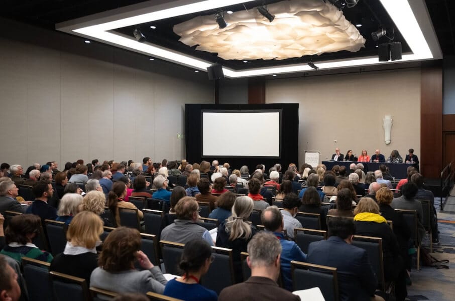 Image of people attending a panel at a scholarly conference